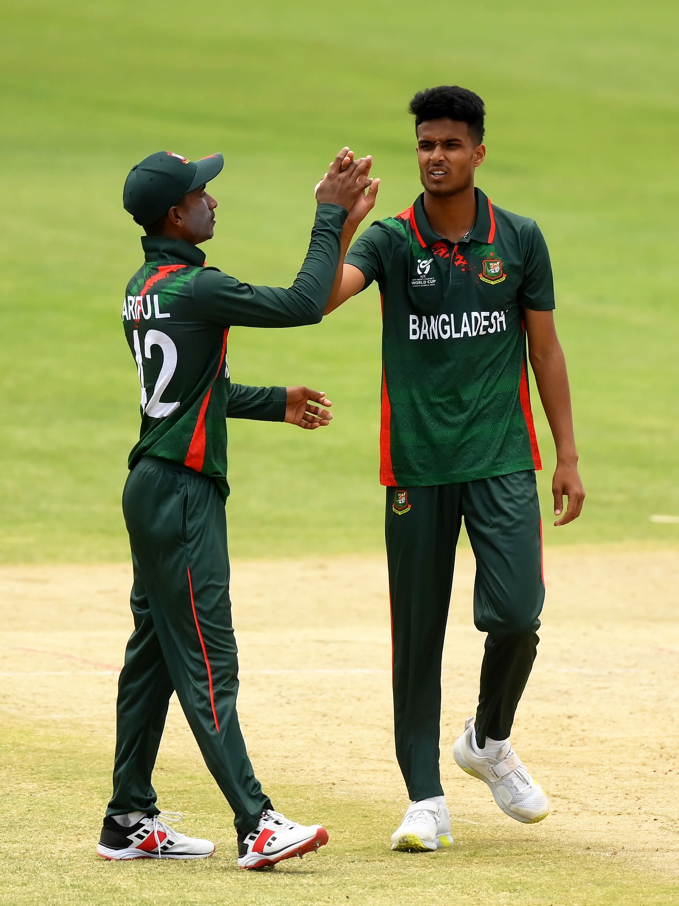 Ariful Islam and Rohanat Doullah Borson celebrate Akash Chand's wicket