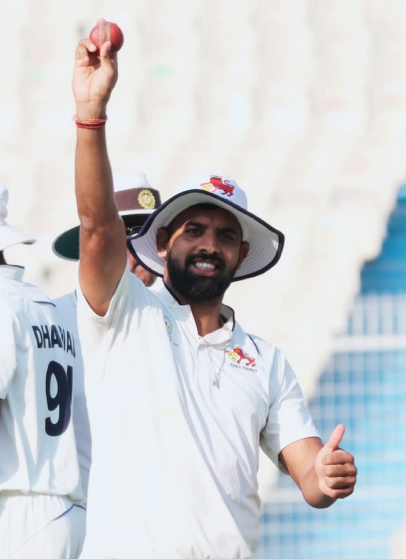 Mohit Avasthi holds the ball up after bagging a seven-for
