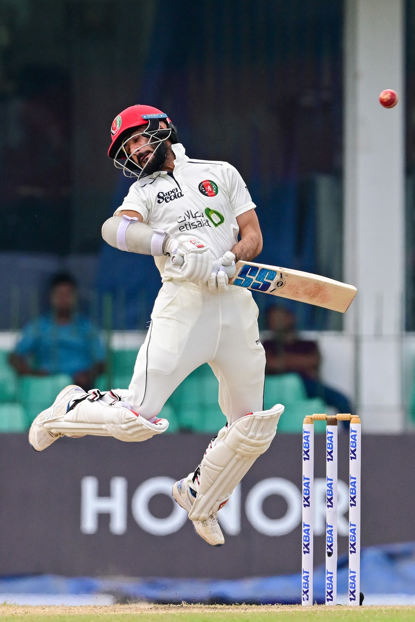 Ikram Alikhil is shaken by a bouncer