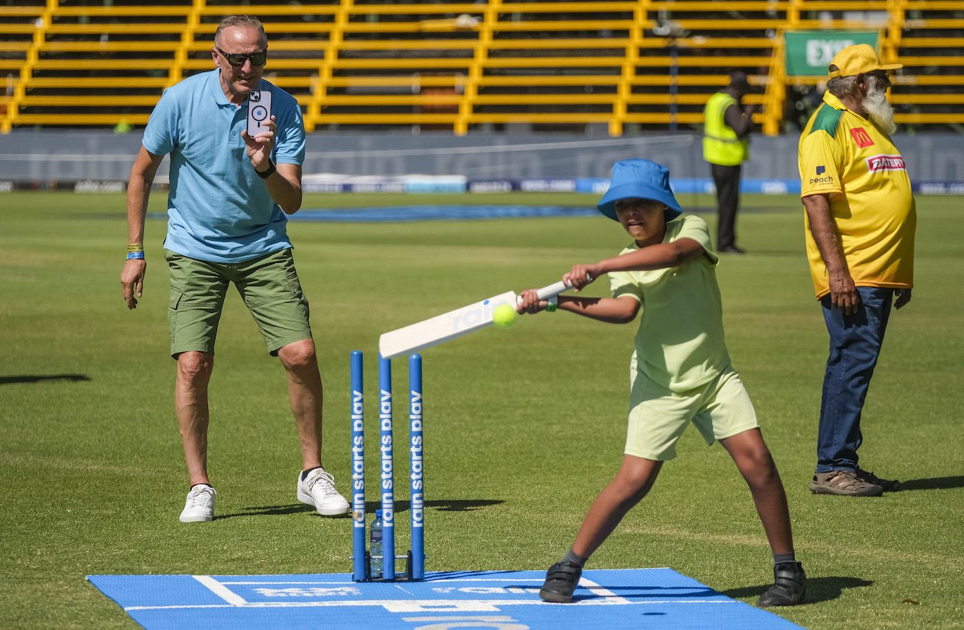 Allan Donald takes a video of a kid batting