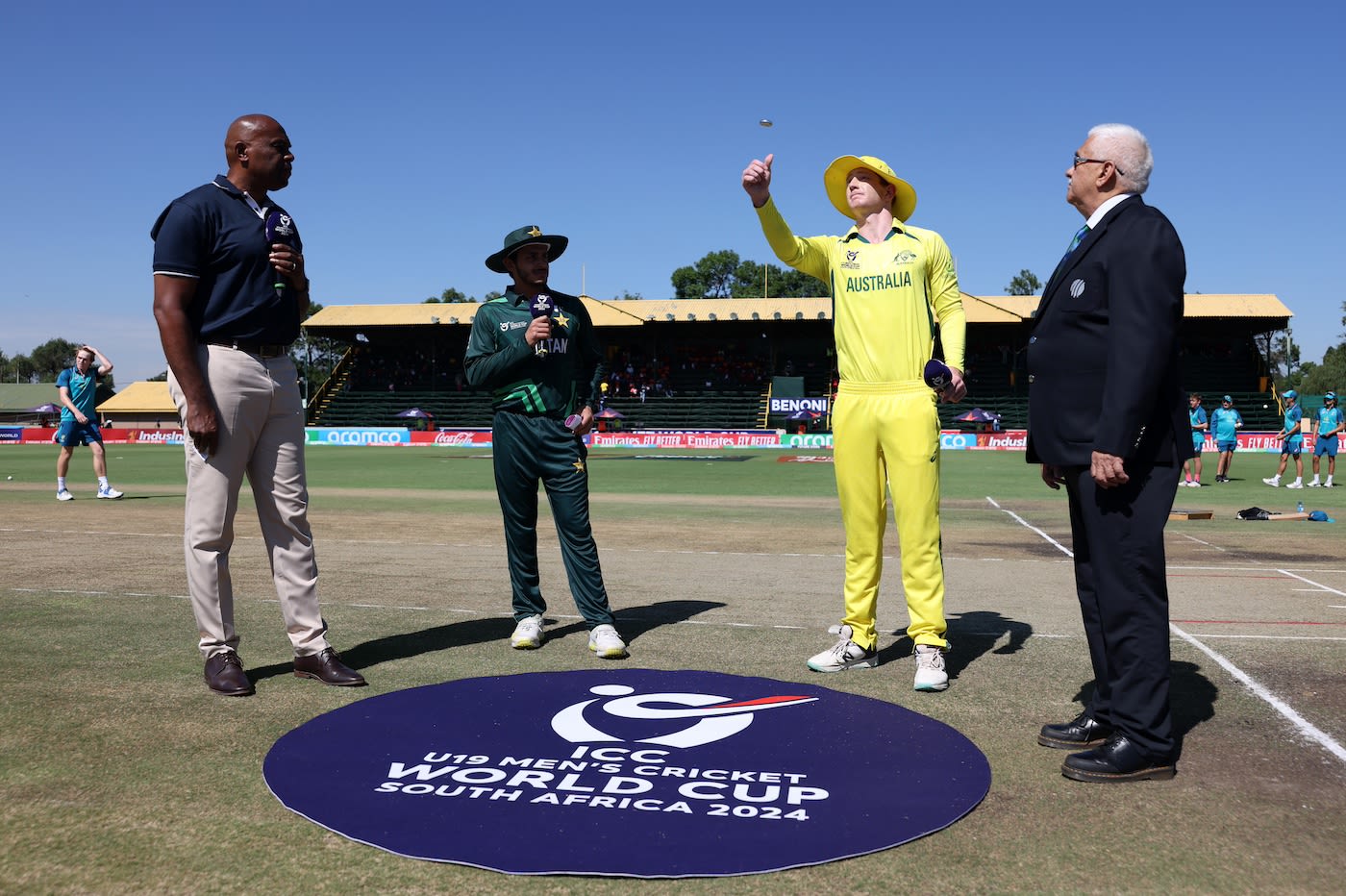 Hugh Weibgen spins the coin and Saad Baig calls at the semi-final toss