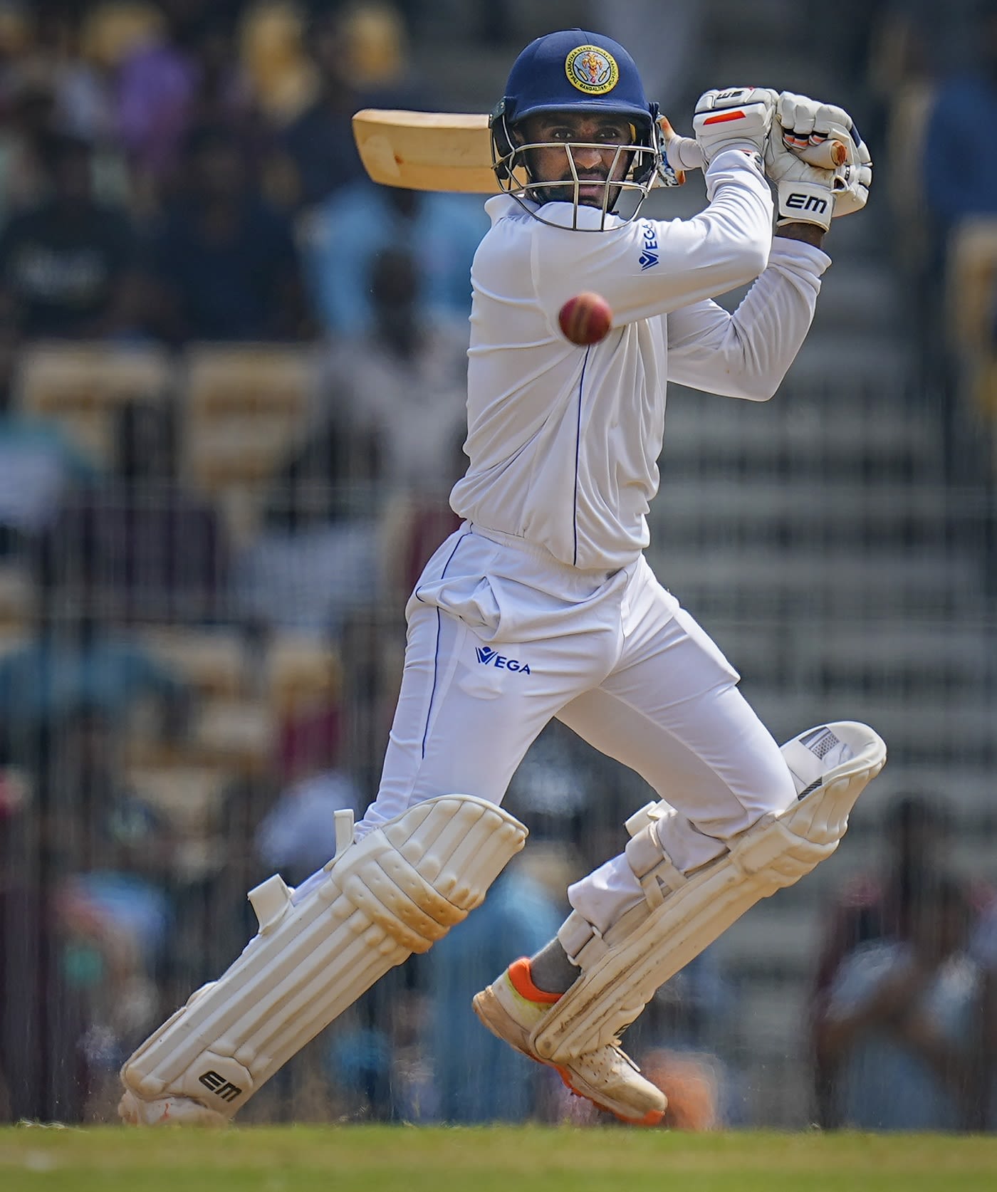 Sharath Srinivas slaps the ball away