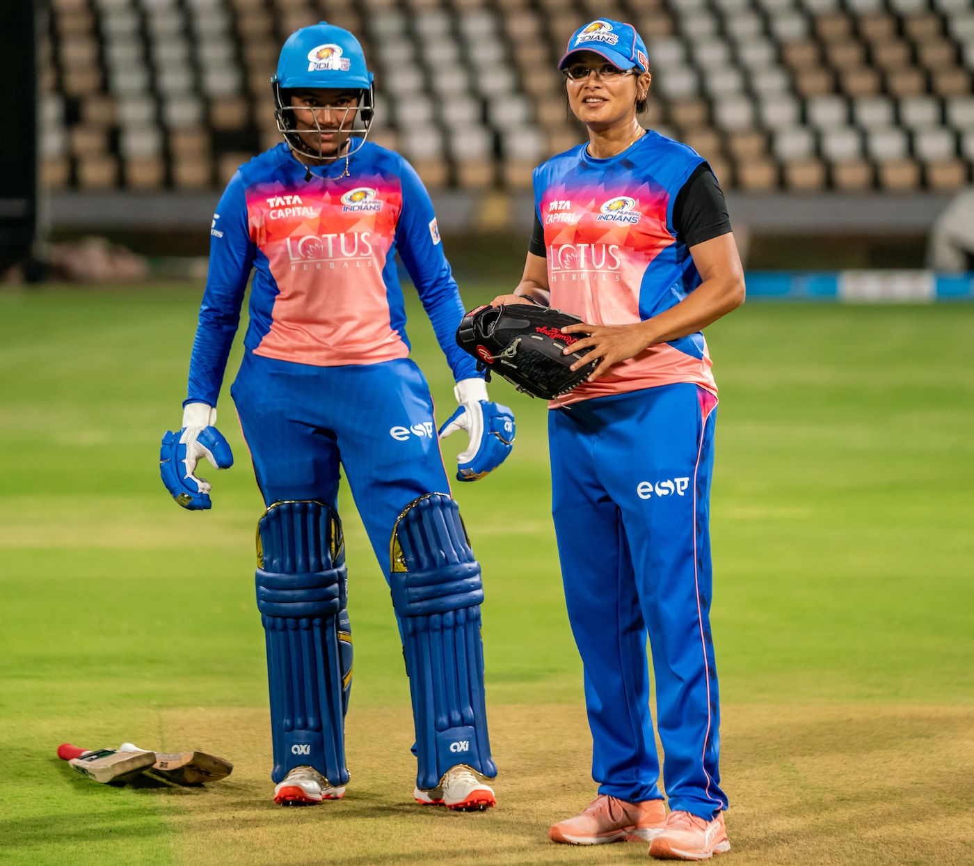 Batting Coach Devika Palshikar goes over range hitting with Sajeevan Sajana at training