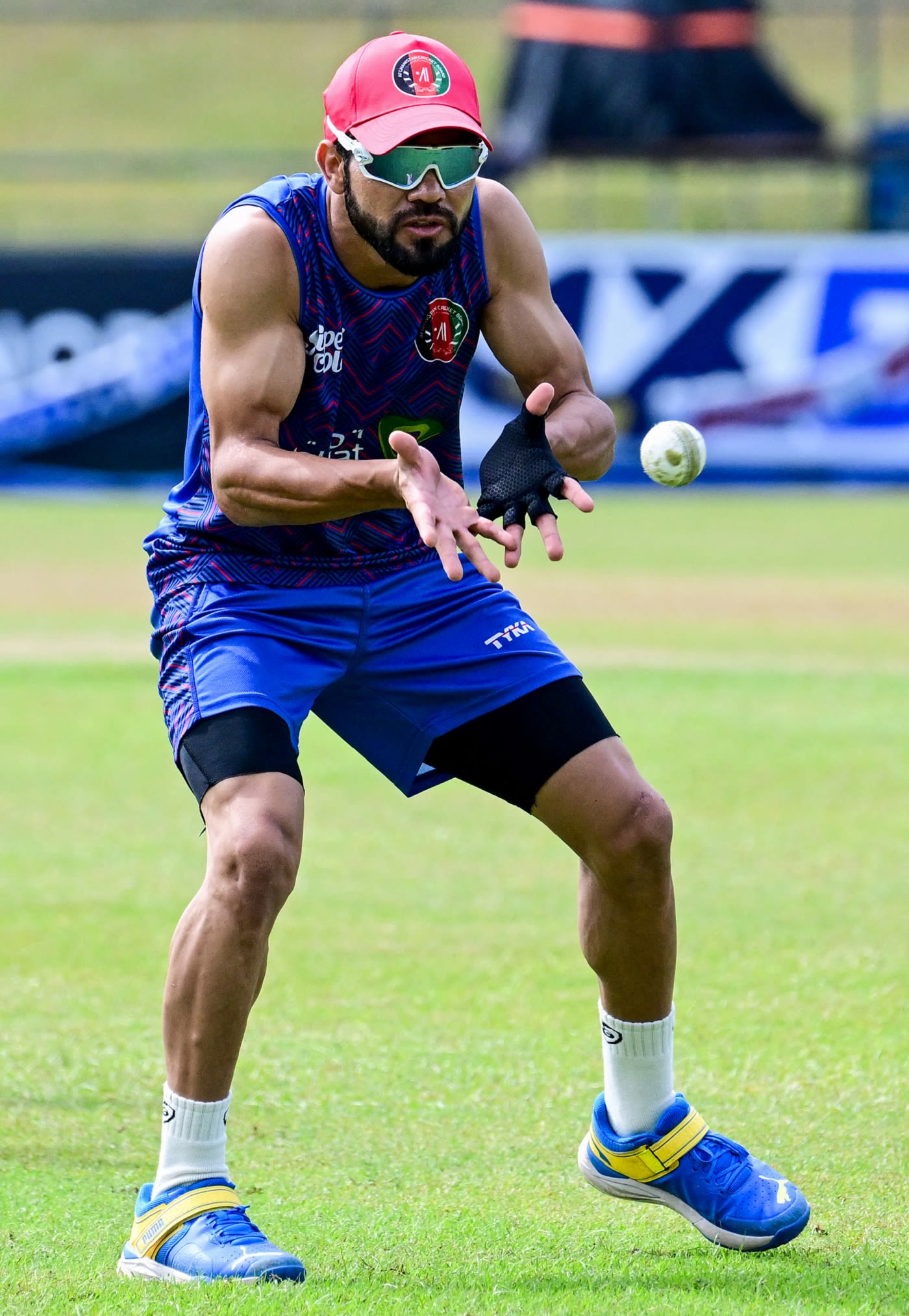 Qais Ahmad prepares to catch the ball