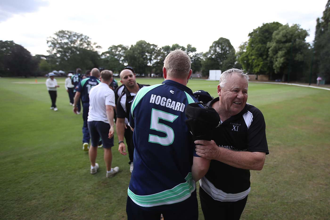 Mike Procter shakes hands with Matthew Hoggard during a PCA match at the Hurlingham Club in London