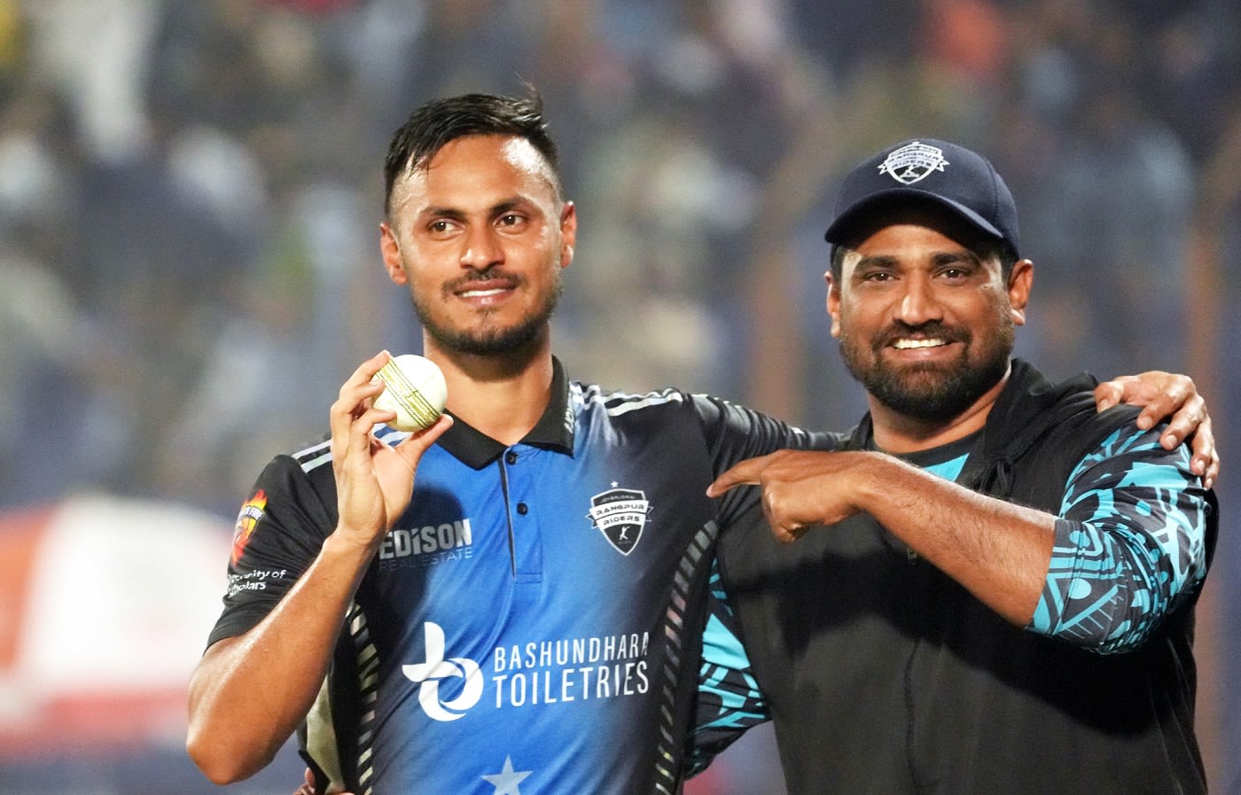 Abu Hider poses with Rangpur Riders bowling coach Tareq Aziz after bagging a five-wicket haul