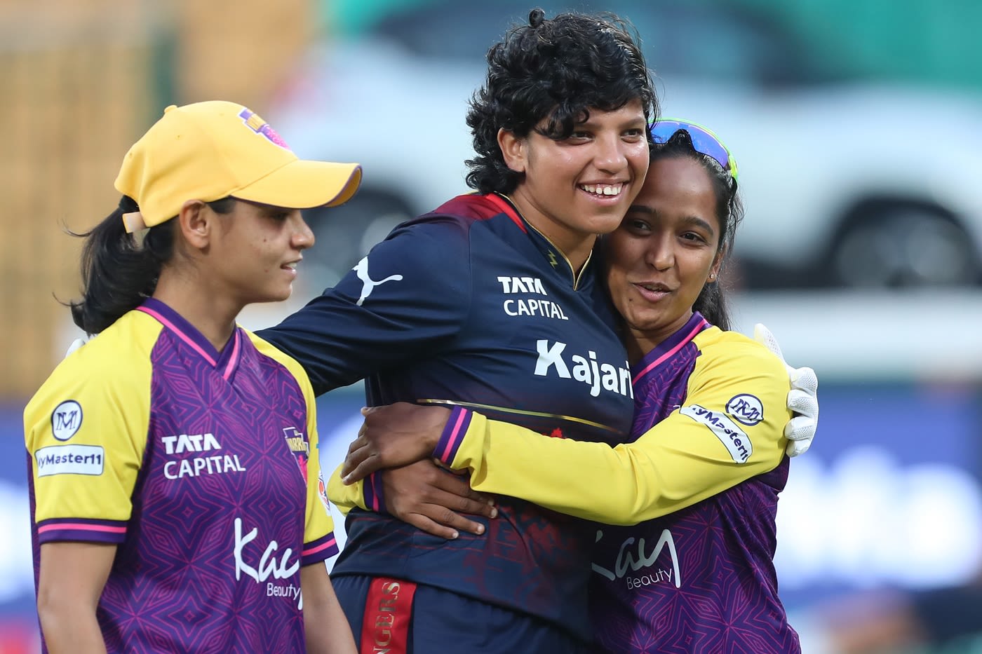 Saima Thakor, Richa Ghosh and Anjali Sarvani share a light moment before the game