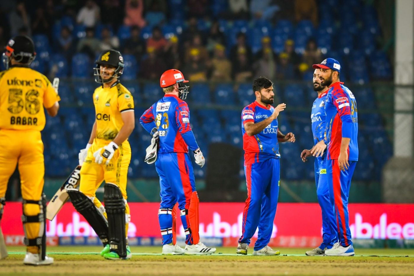 Zahid Mahmood celebrates bowling Saim Ayub with his team-mates, as the latter trudges off
