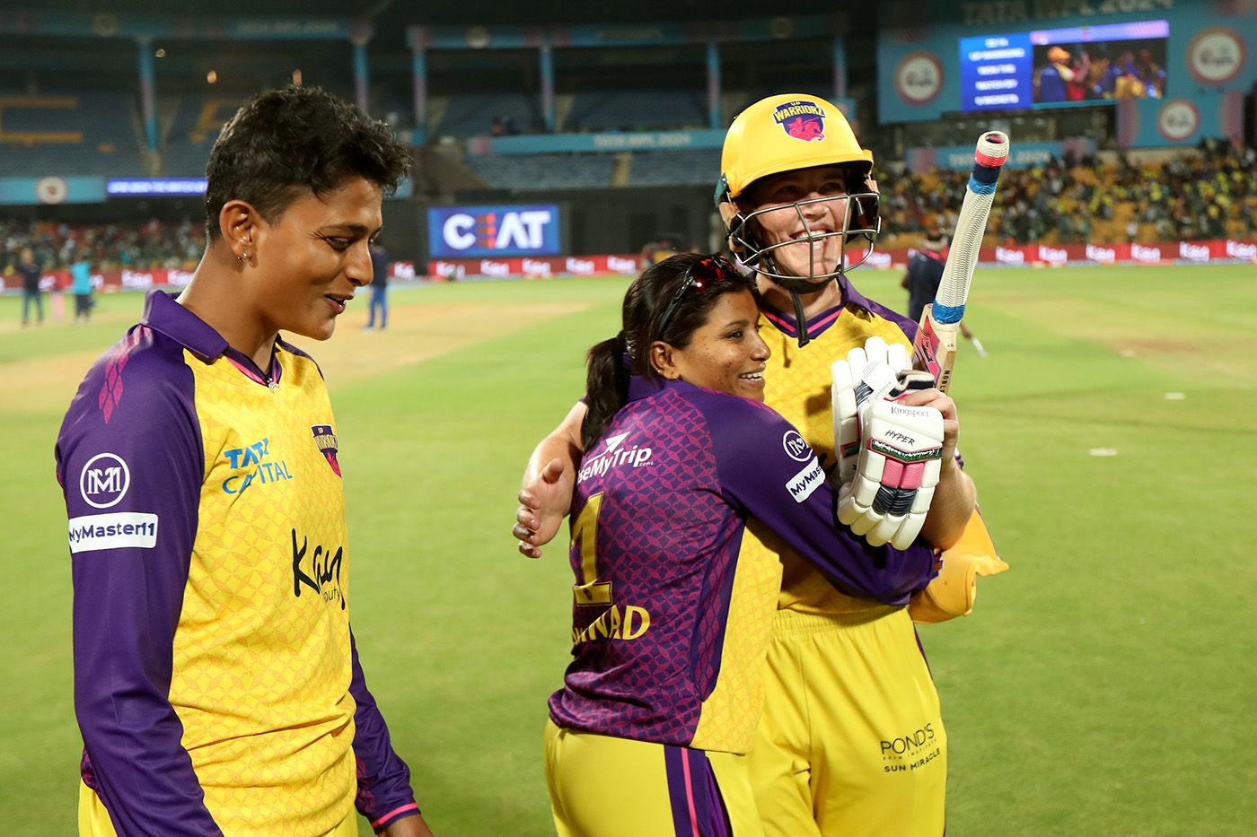 Poonam Khemnar and Rajeshwari Gayakwad greet Grace Harris after the win