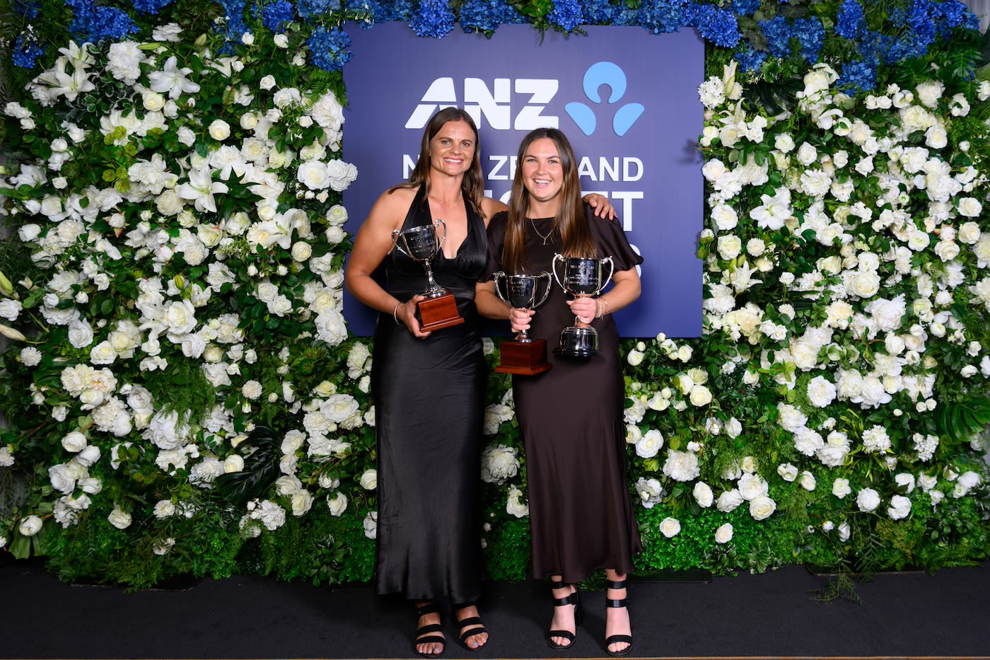 Suzie Bates and Emma Black with their trophies