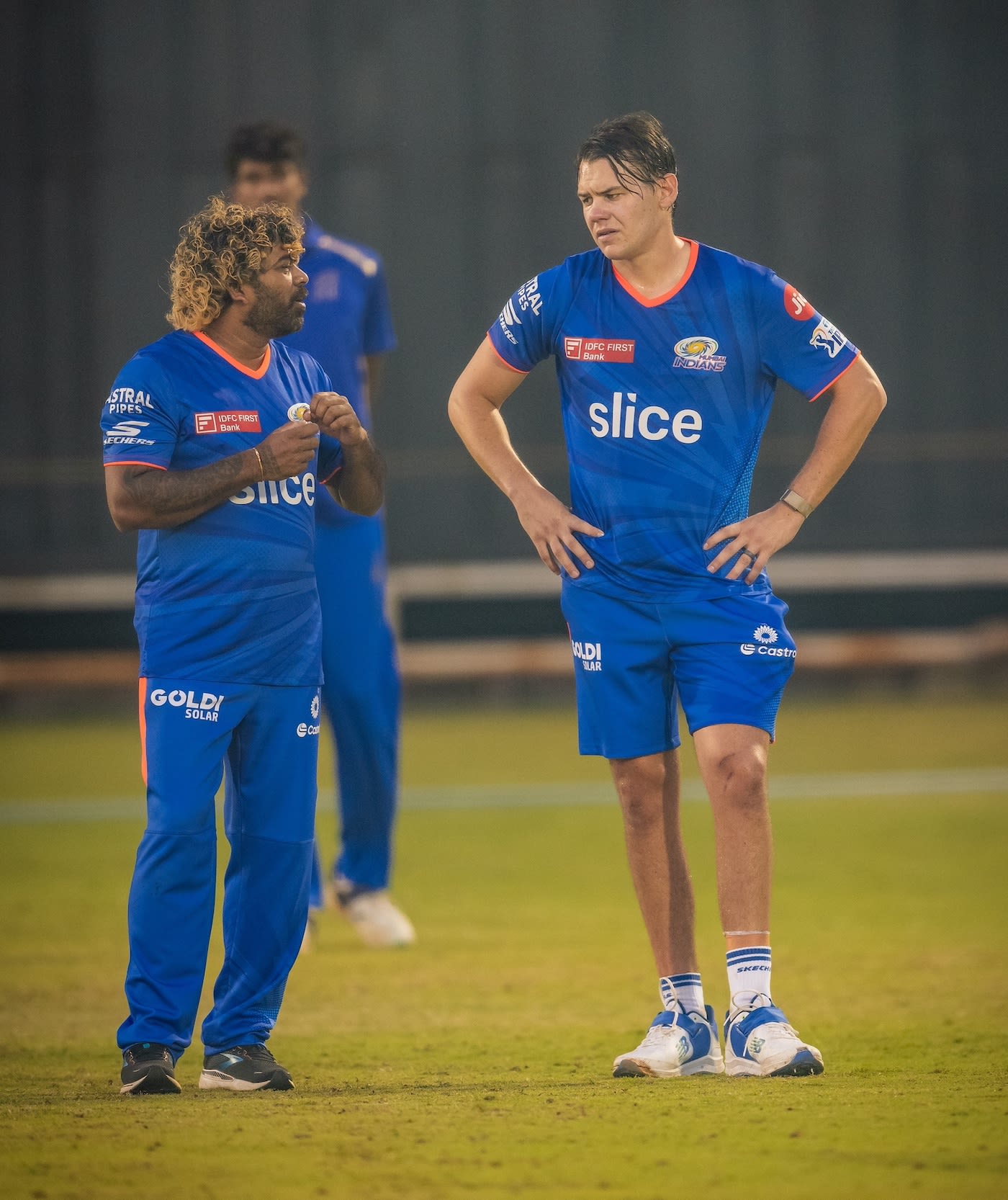 Lasith Malinga has a chat with Gerald Coetzee during a Mumbai Indians net session