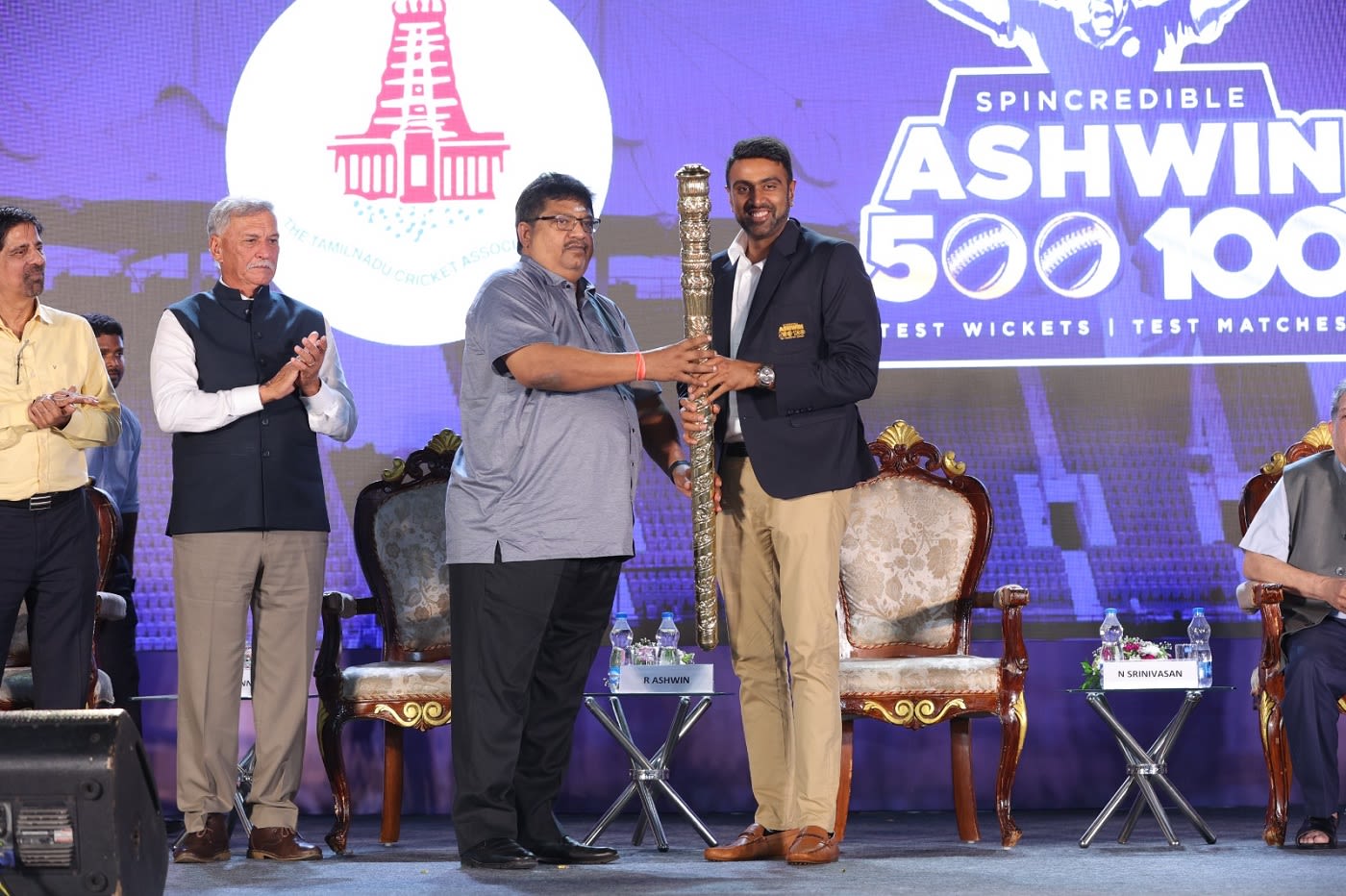 R Ashwin receives a special mace in the company of Roger Binny and K Srikkanth