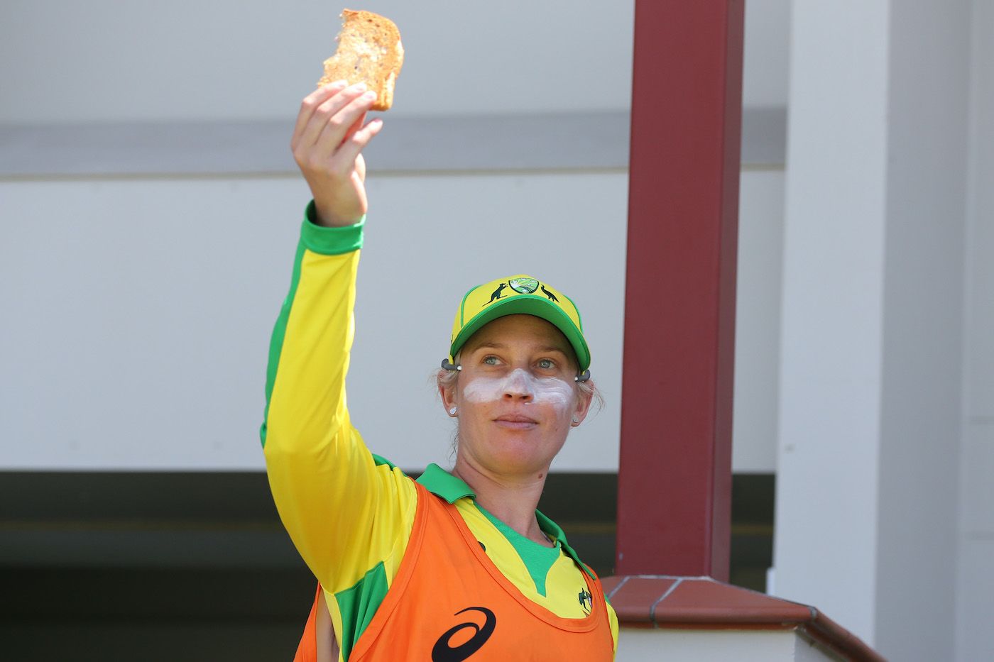 Delissa Kimmince holds the piece toast that set off the fire alarm