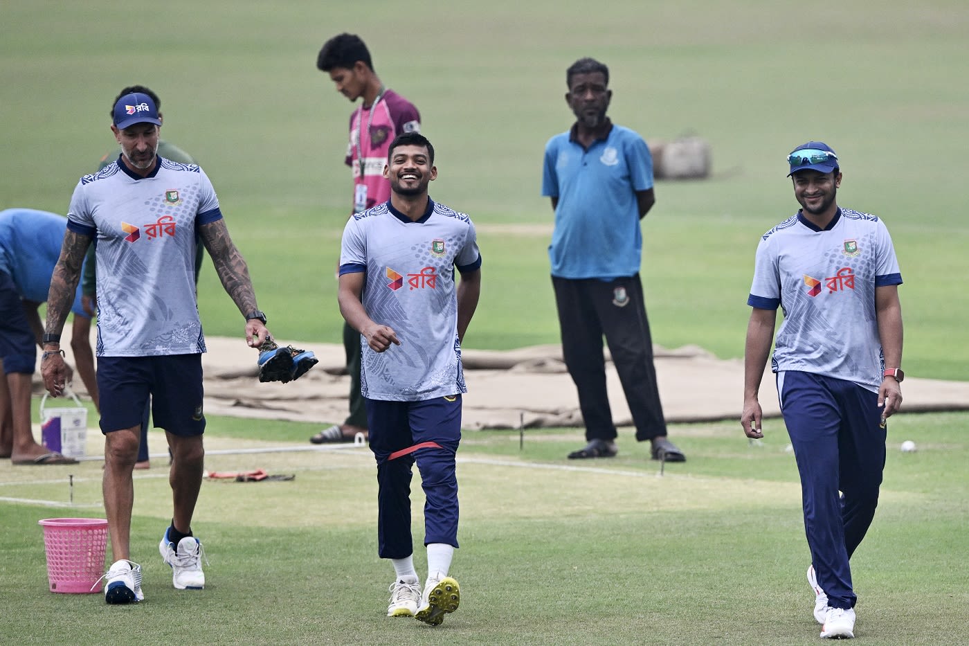 Nic Pothas, Najmul Hossain Shanto and Shakib Al Hasan are all smiles after looking at the pitch