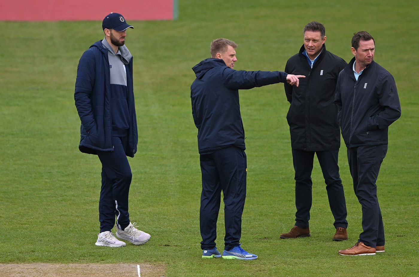 Scott Borthwick chats to the umpires while James Vince looks on