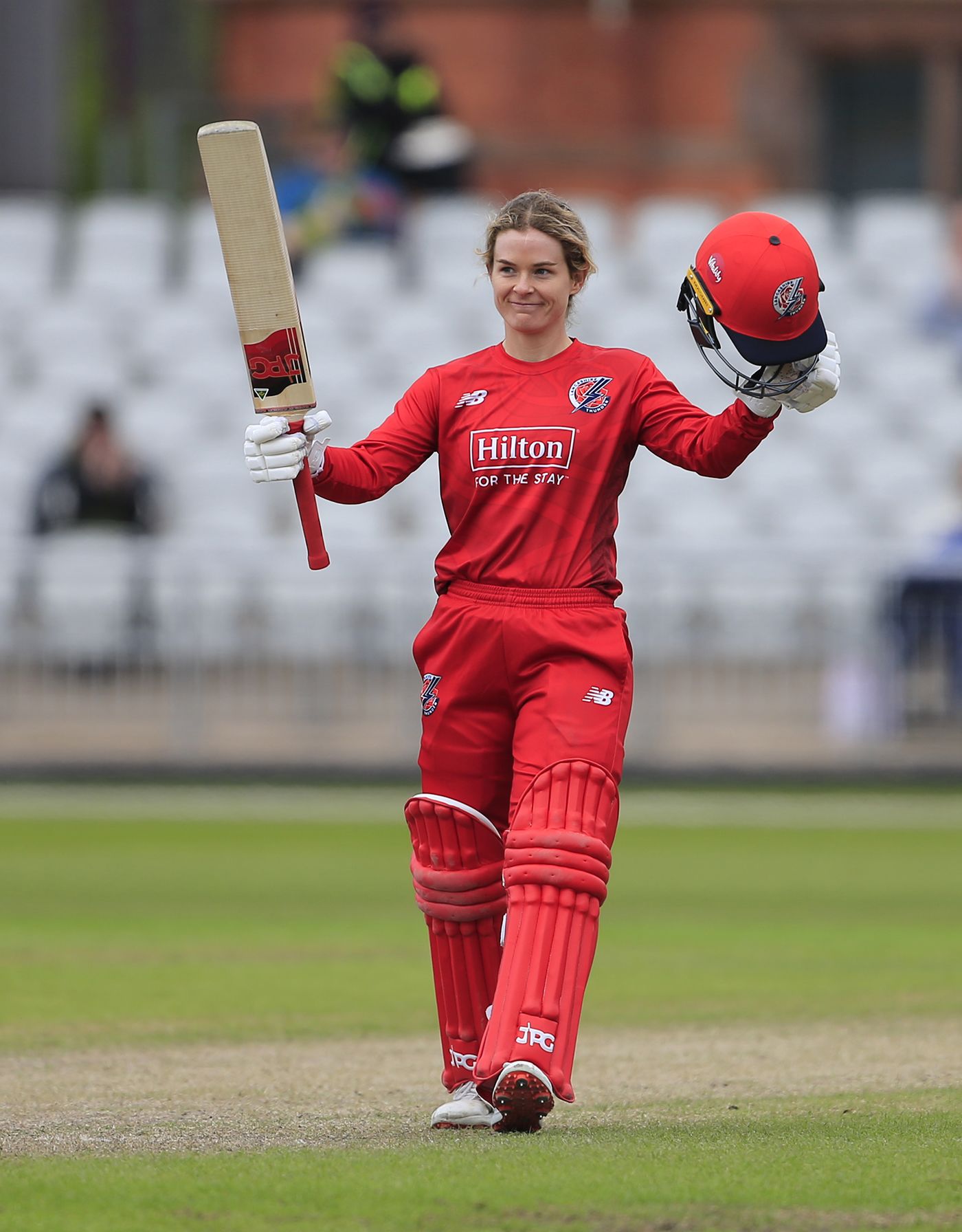 Katie Mack celebrates after reaching her century