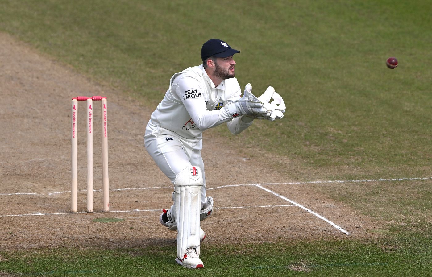 Durham's Ollie Robinson gathers the ball