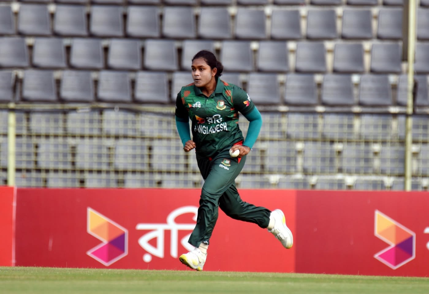 Fariha Trisna runs in with the new ball