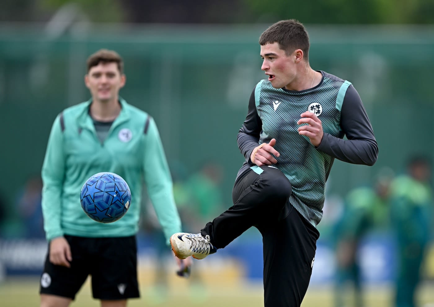 Neil Rock warms up with some football