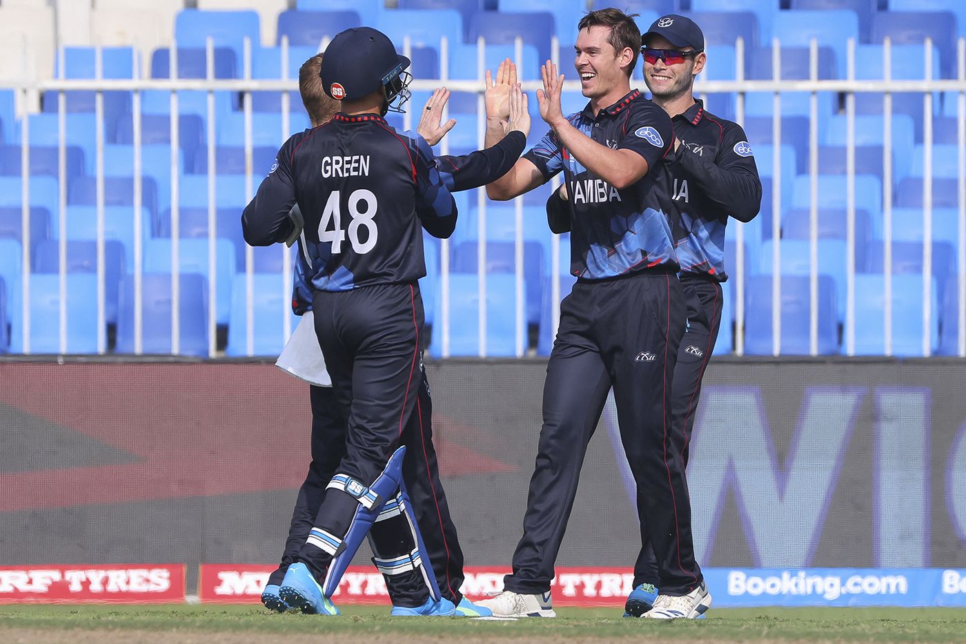 Michael van Lingen celebrates with his team-mates after taking a catch