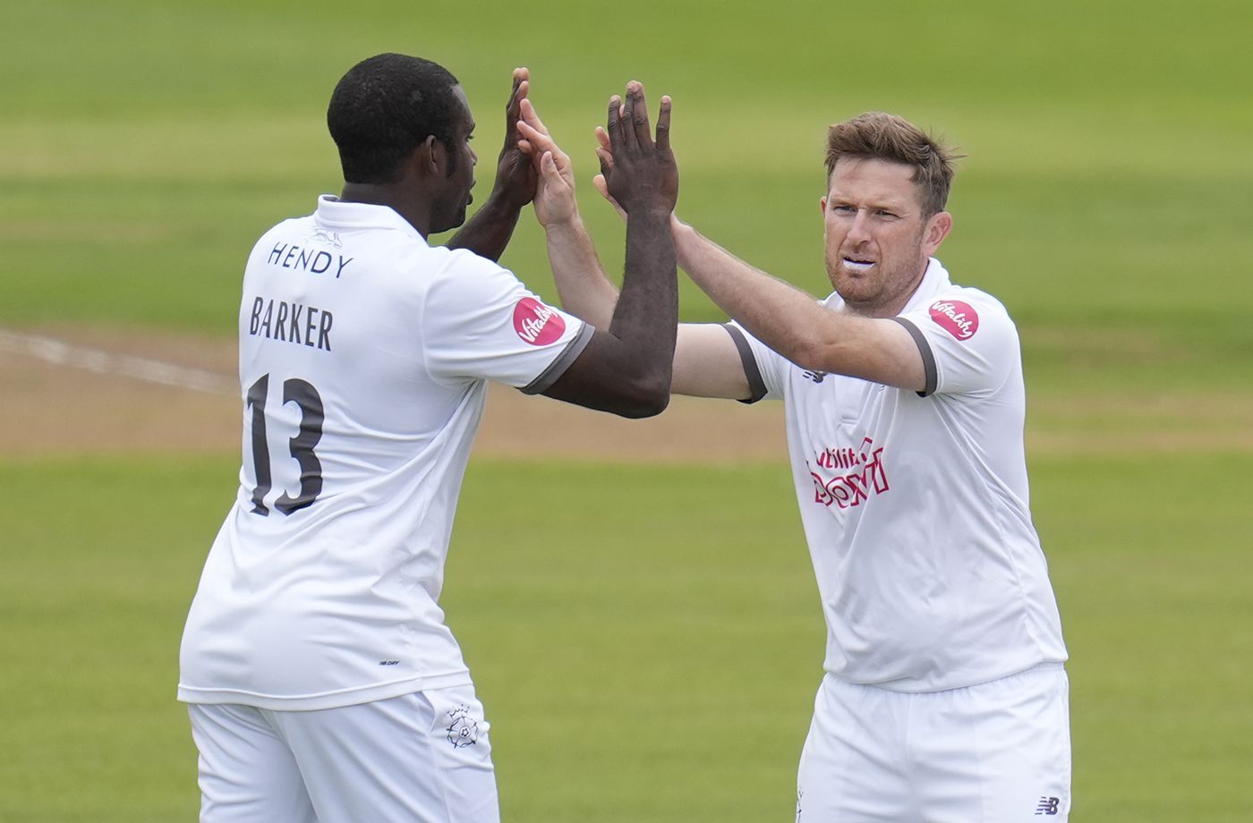Liam Dawson gets a high five from Keith Barker