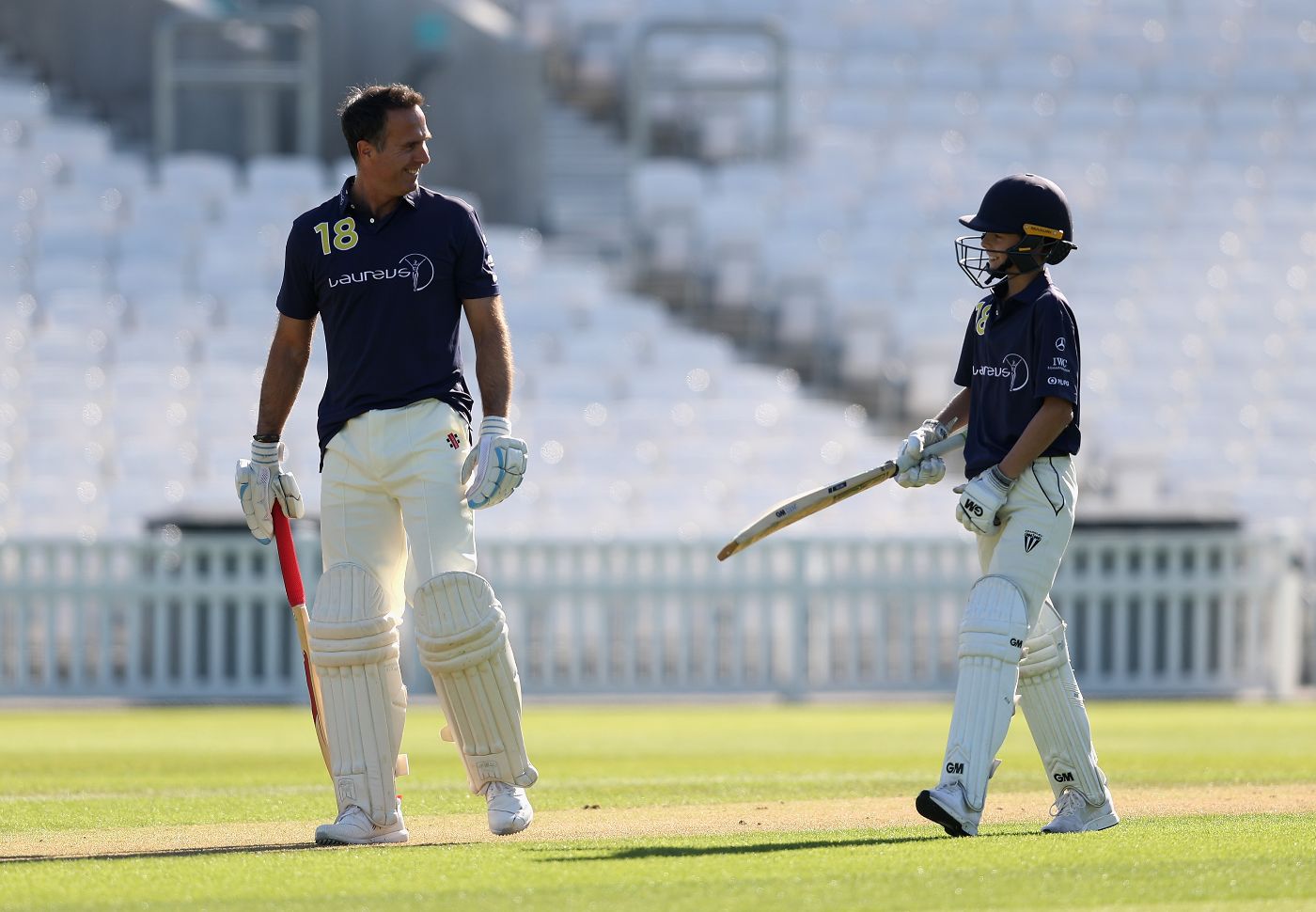 Michael and Archie Vaughan batting together at a Laureus event in 2008
