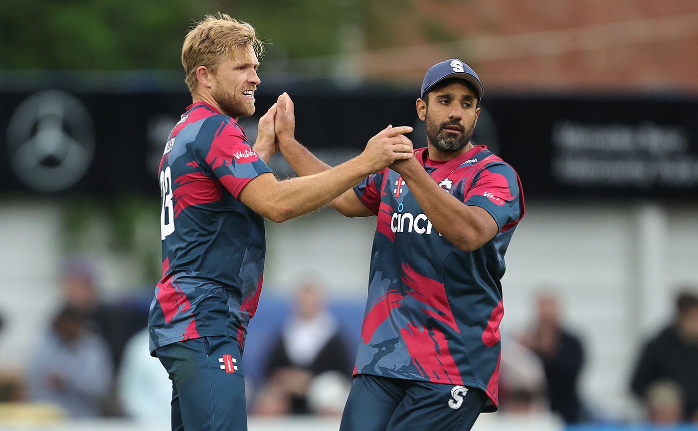 David Willey and Ravi Bopara celebrate the fall of a wicket