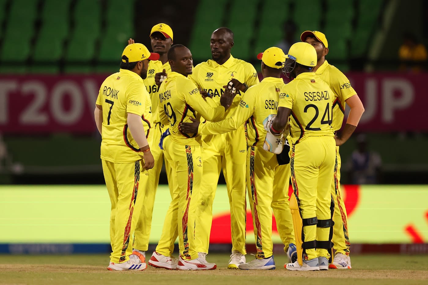 Cosmas Kyewuta celebrates a wicket with his team-mates