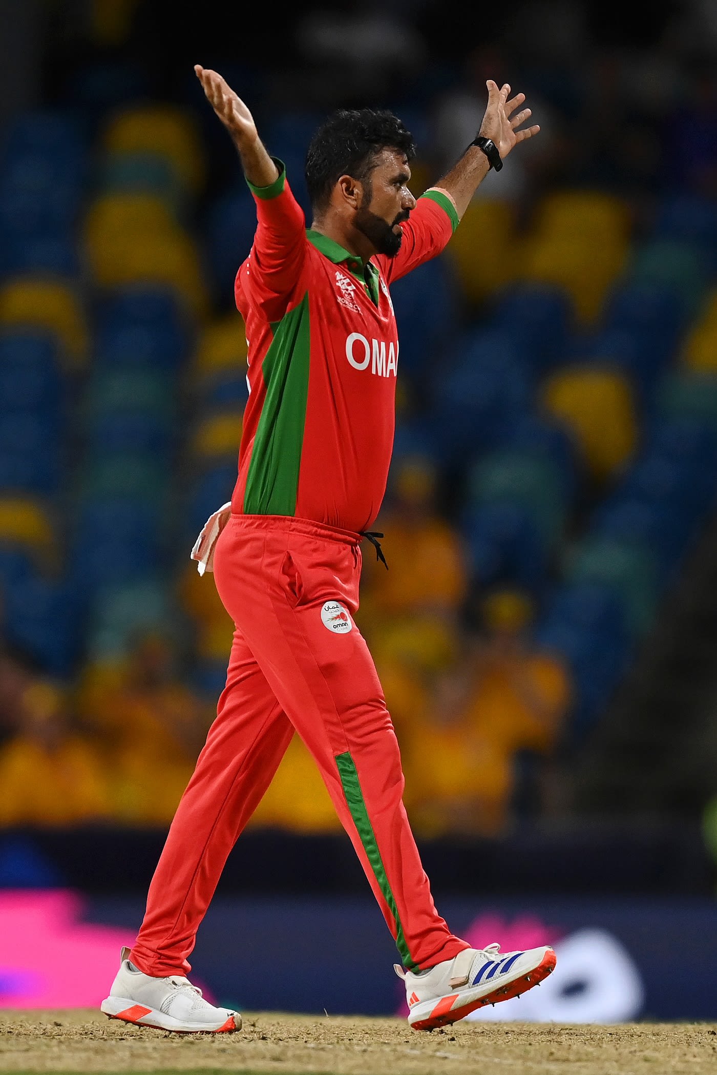 Bilal Khan celebrates the wicket of Travis Head