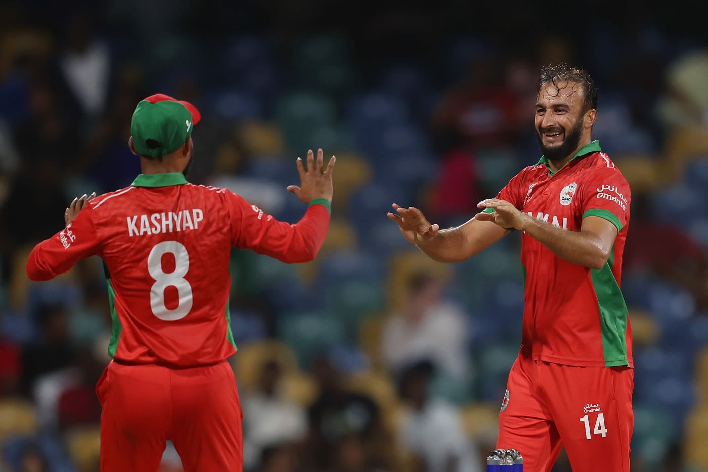 Mehran Khan and Kashyap Prajapati celebrate a wicket