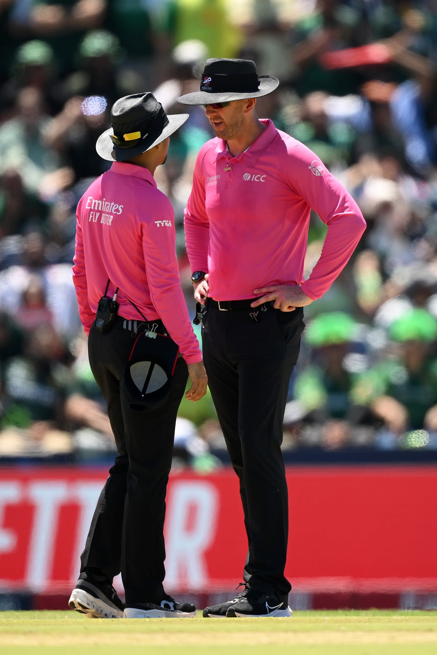 Umpires Allahuddien Paleker and Michael Gough discuss before calling a dead ball