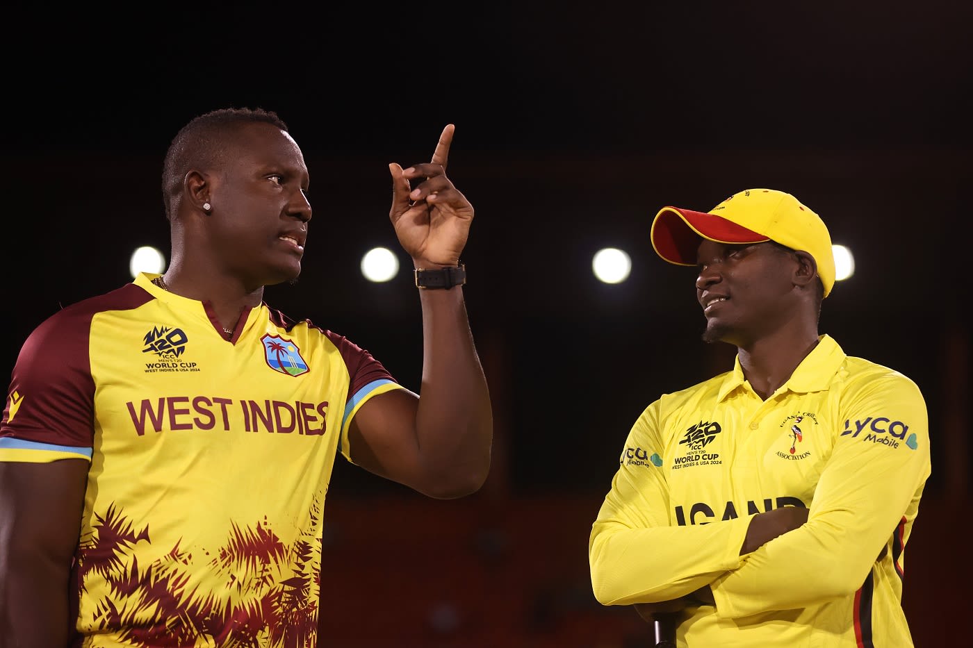Captains Rovman Powell and Brian Masaba chat at the toss