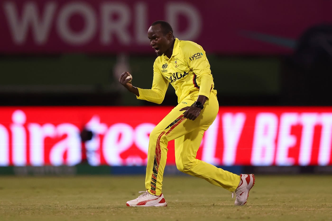 Brian Masaba celebrates after dismissing Nicholas Pooran