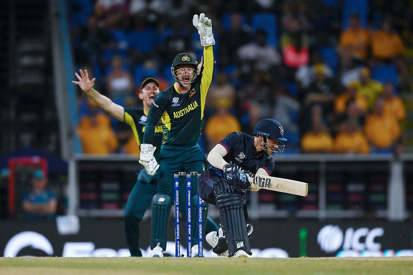 Australia appeal successfully for the wicket of Zane Green