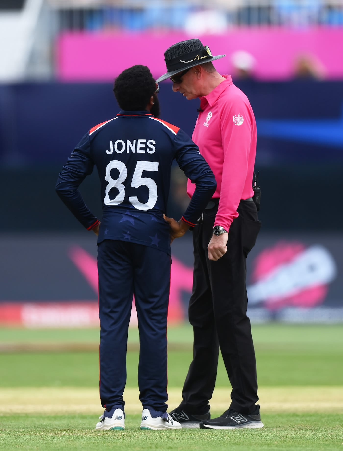 Aaron Jones checks with Paul Reiffel after USA were penalised five runs