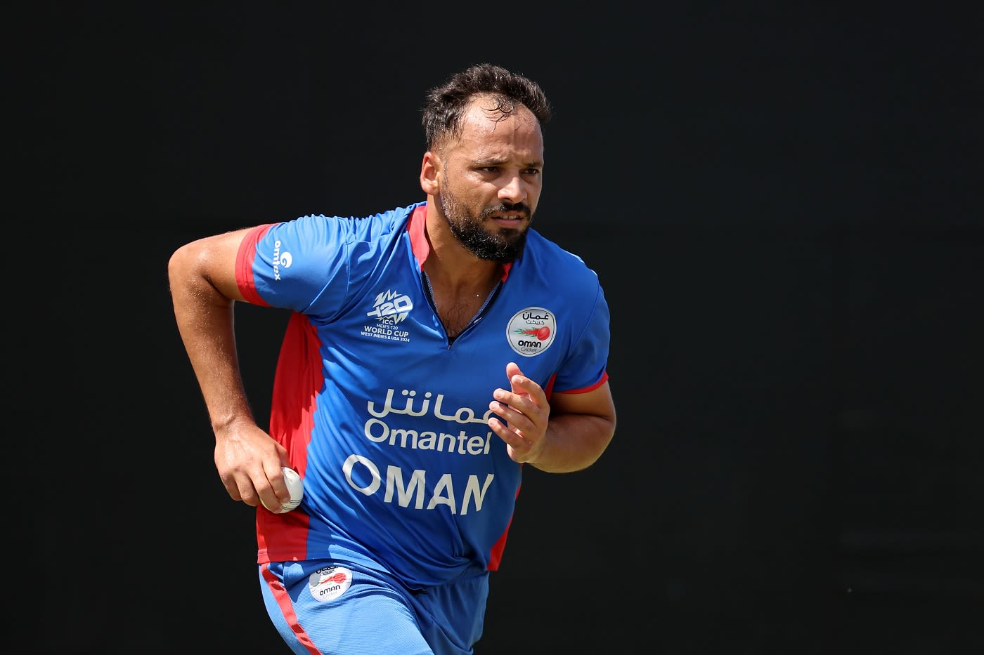 Fayyaz Butt runs in during a net-bowling session