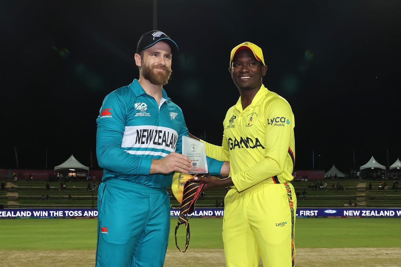 Kane Williamson is presented with a gift from Brian Masaba