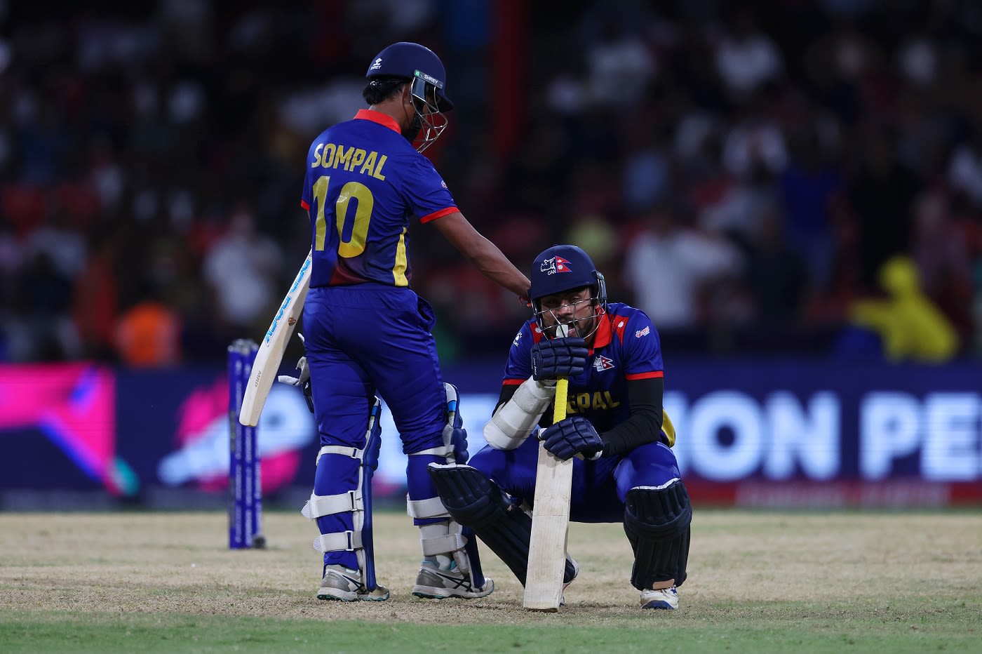 Gulsan Jha is consoled by Sompal Kami after Nepal came agonisingly close