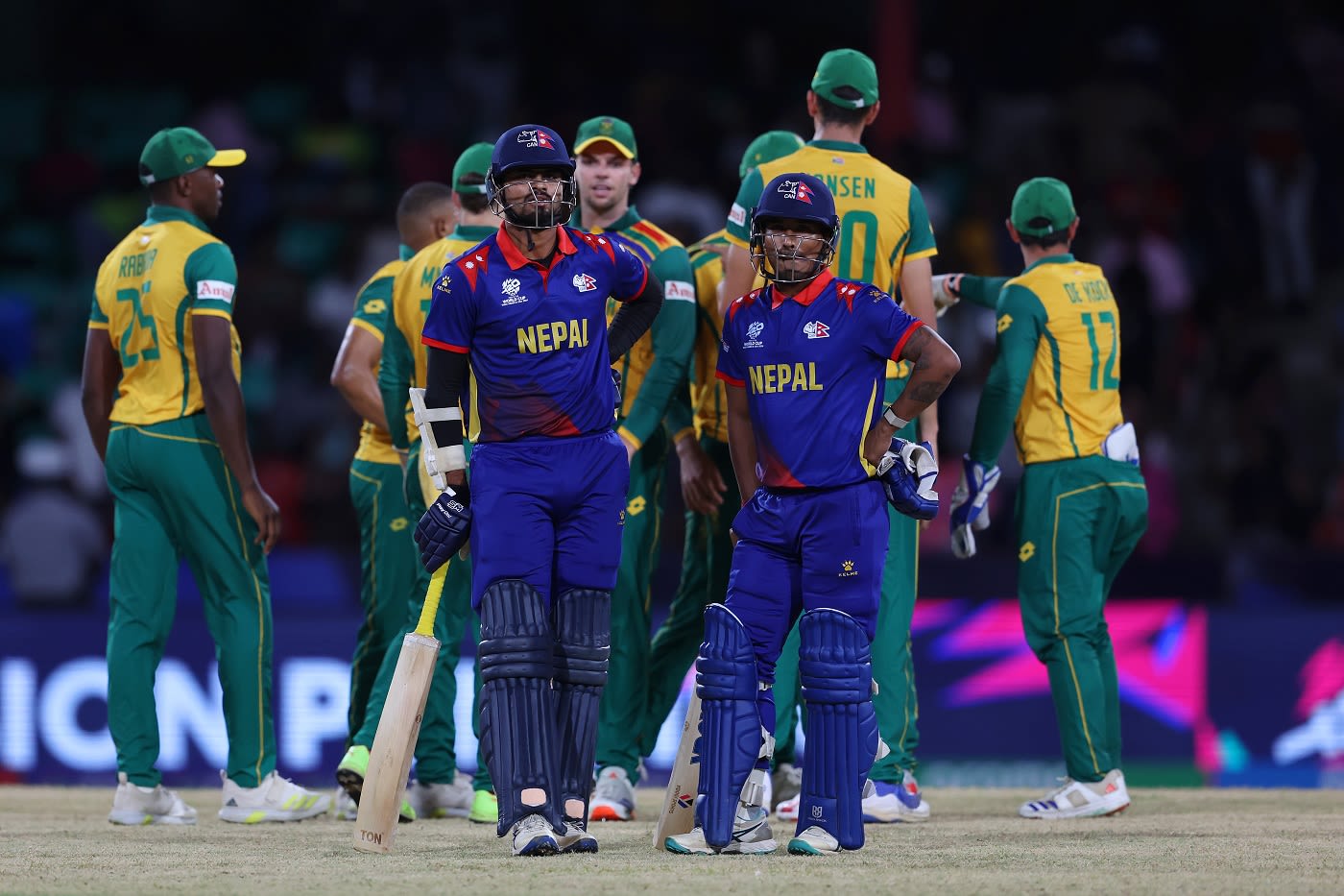 Gulsan Jha and Sompal Kami wait for the the third umpire's run out call on the last ball