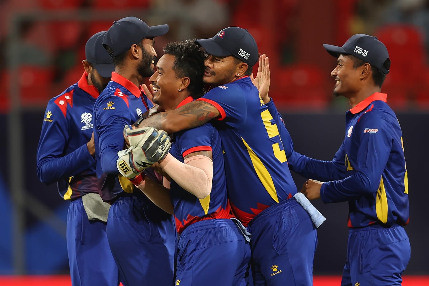 Sompal Kami is congratulated by his team-mates after he dismissed Tanzid Hasan with the first ball of the match