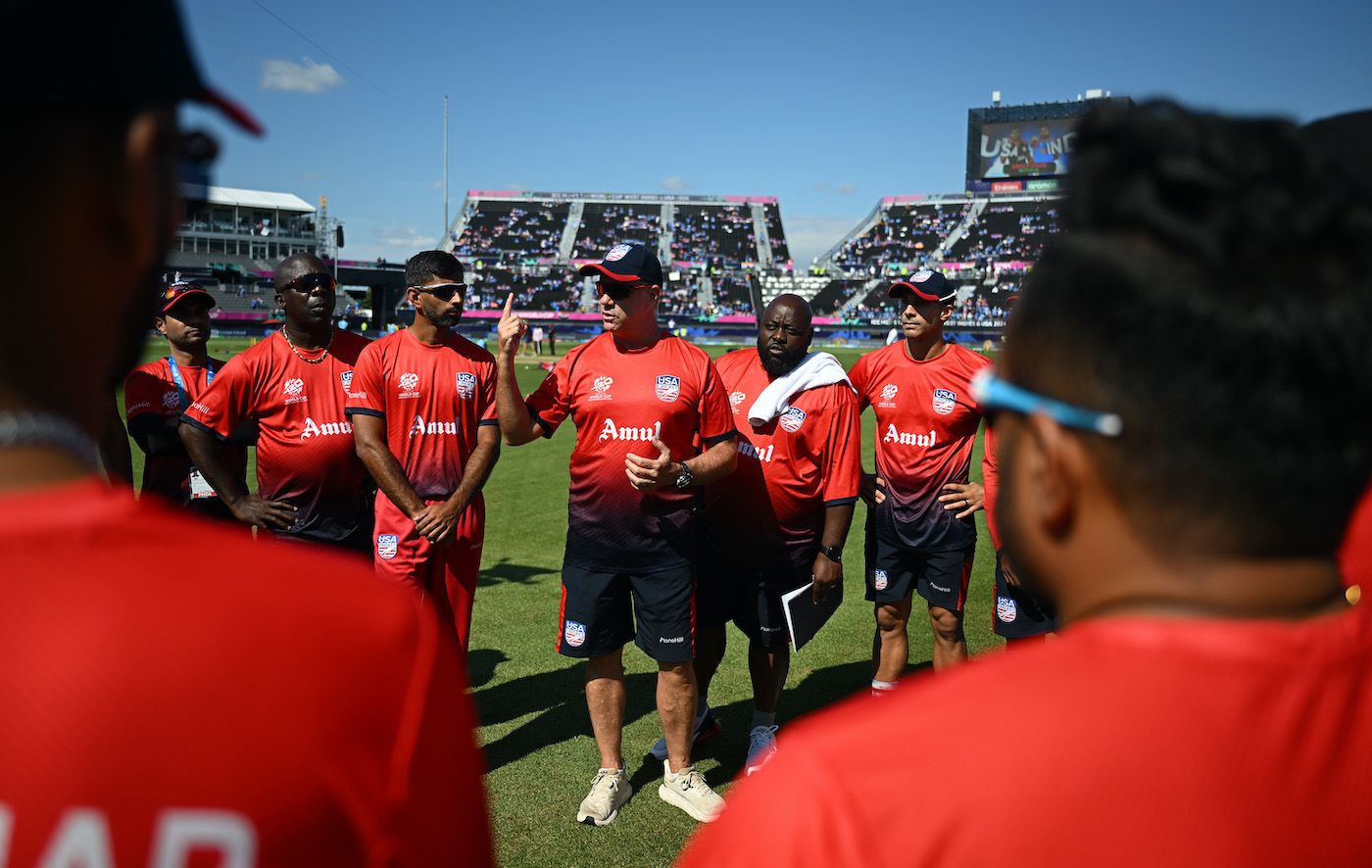 USA coach Stuart Law addresses the side before their match against India