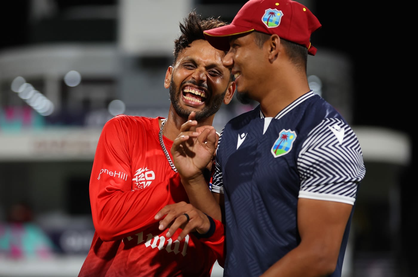 Milind Kumar and Gudakesh Motie share a light moment