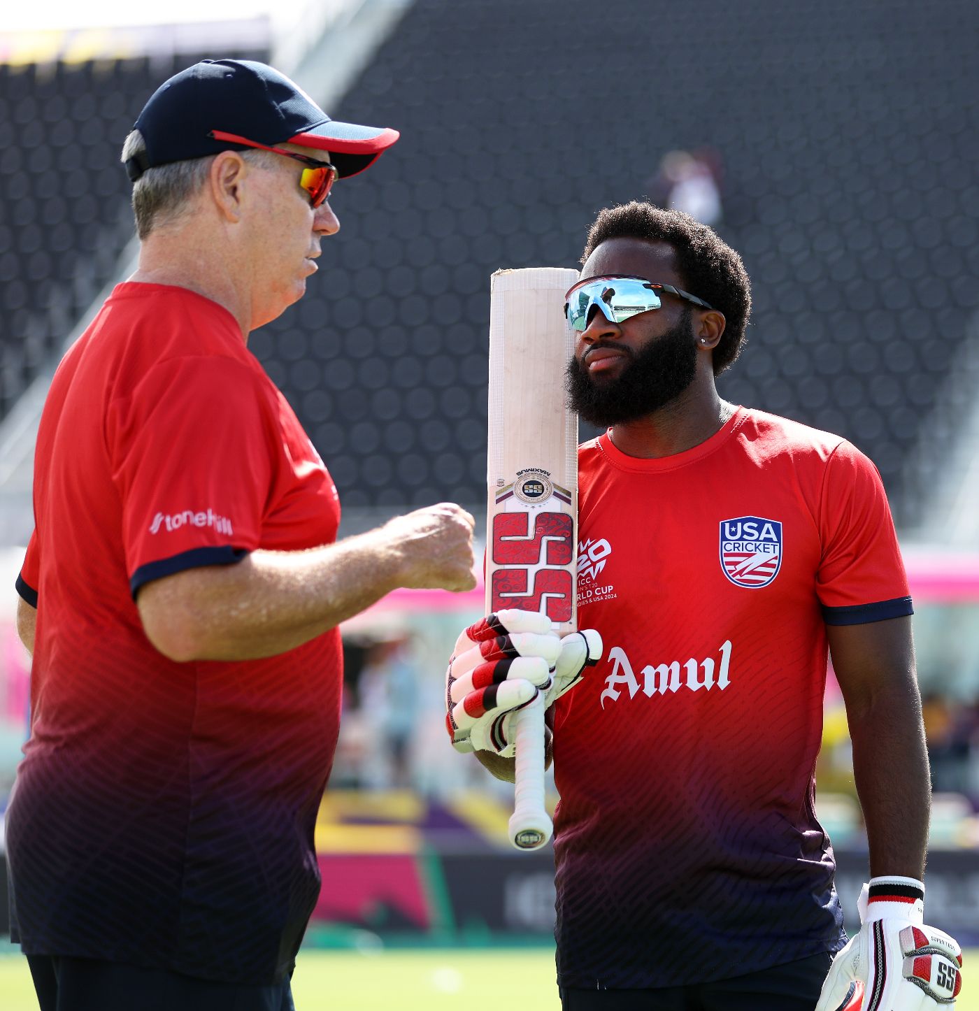 USA coach Stuart Law has a chat with Aaron Jones