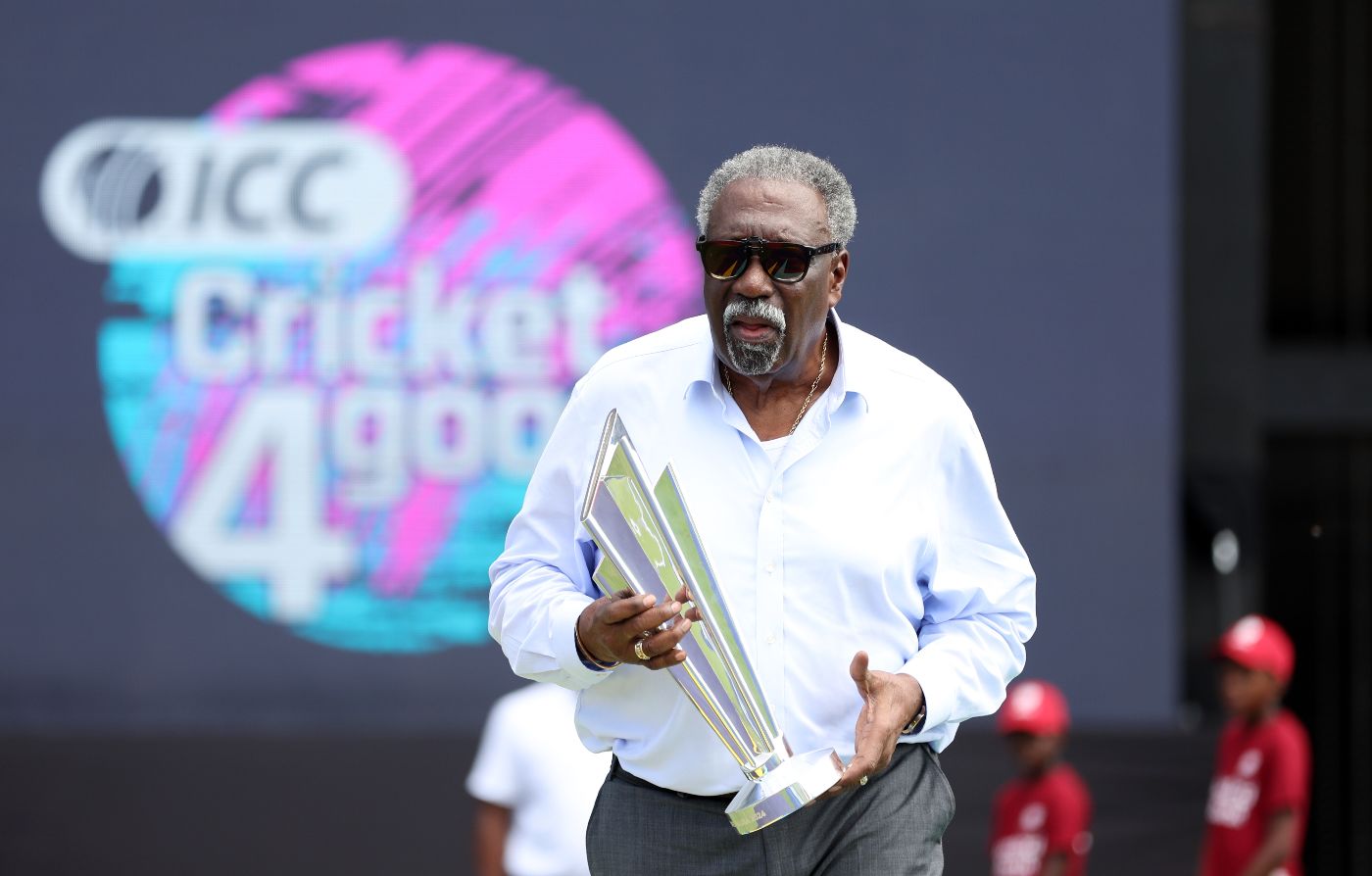 Former West Indies captain Clive Lloyd brings out the T20 World Cup trophy in Bridgetown