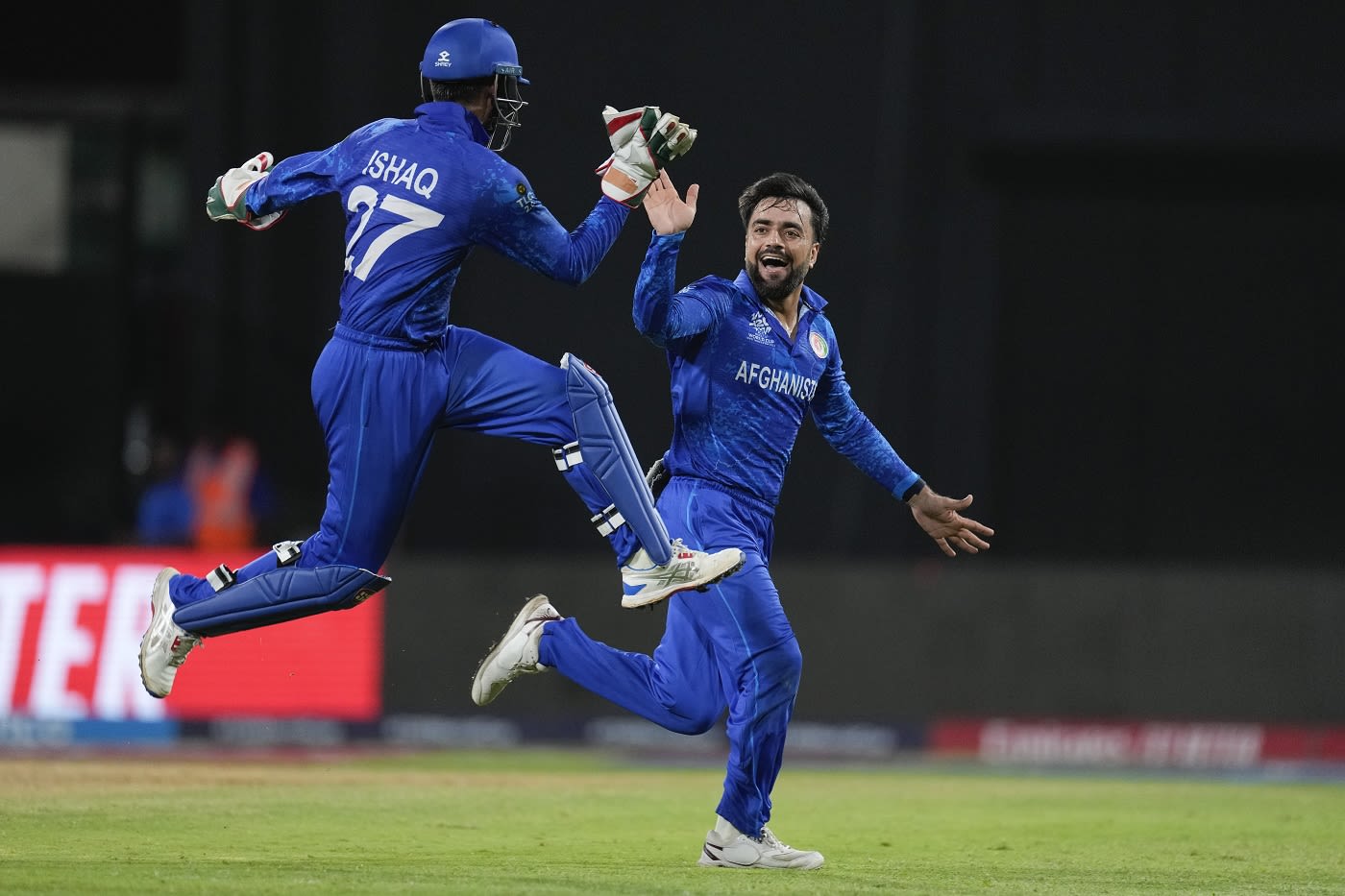 Mohammad Ishaq and Rashid Khan celebrate Rishad Hossain's wicket
