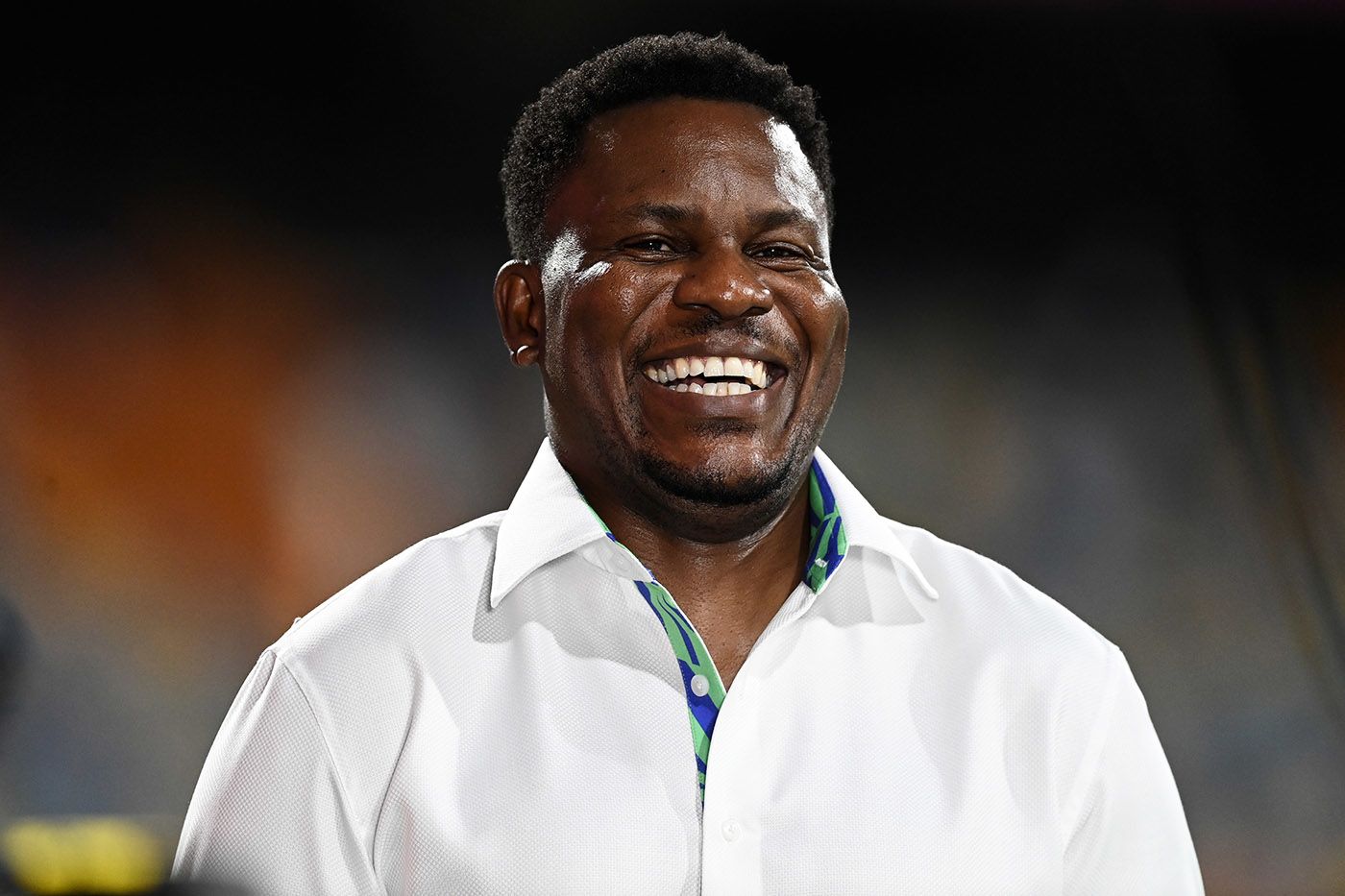 Pommie Mbangwa smiles