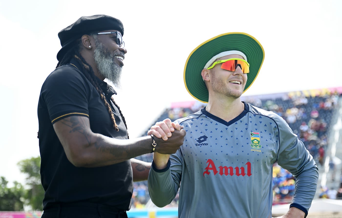 Chris Gayle catches up with David Miller before the final