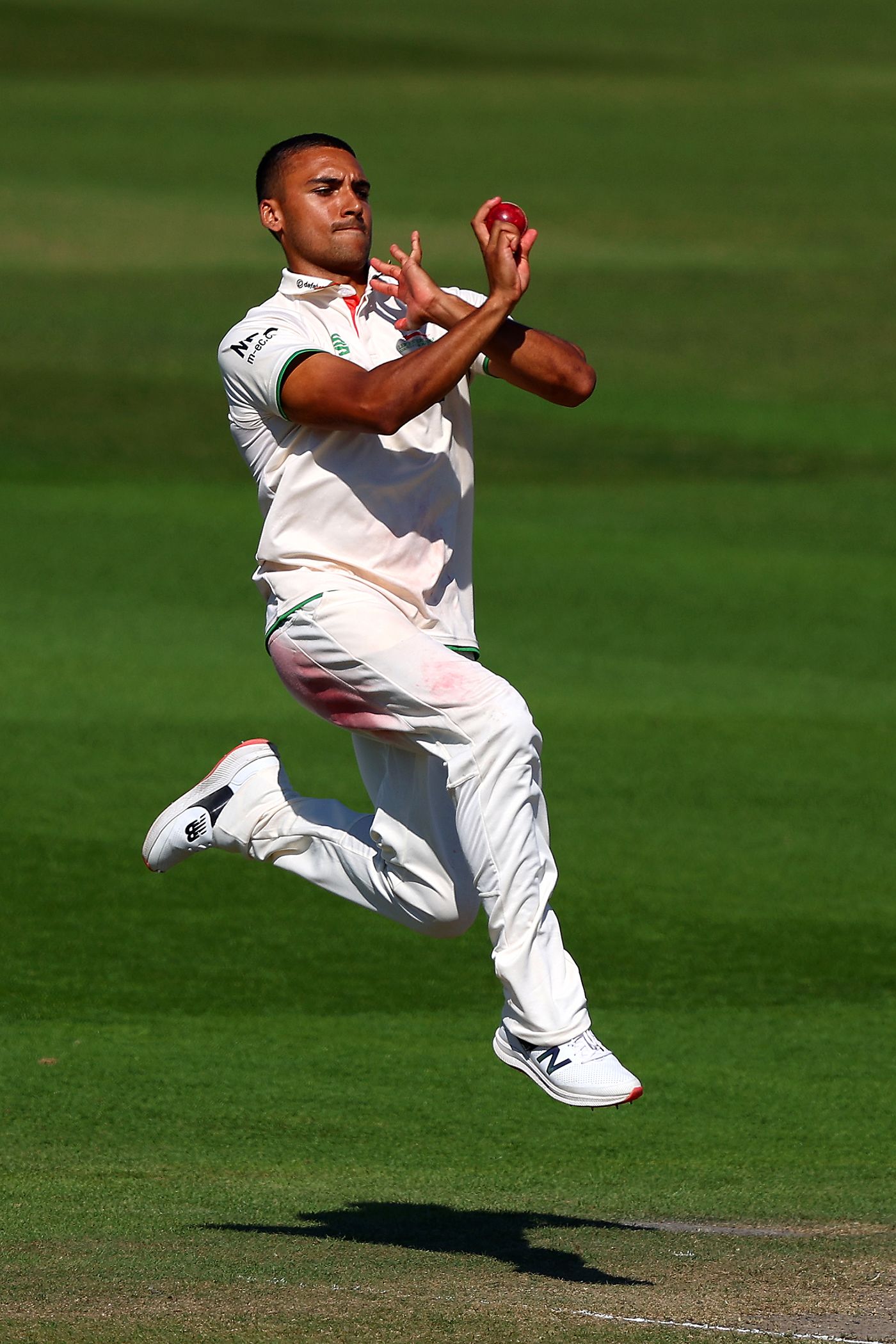 Ben Mike leaps into his delivery stride