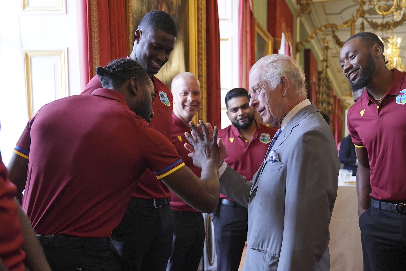 Jeremiah Louis teaches Britain's King Charles his way of shaking hands