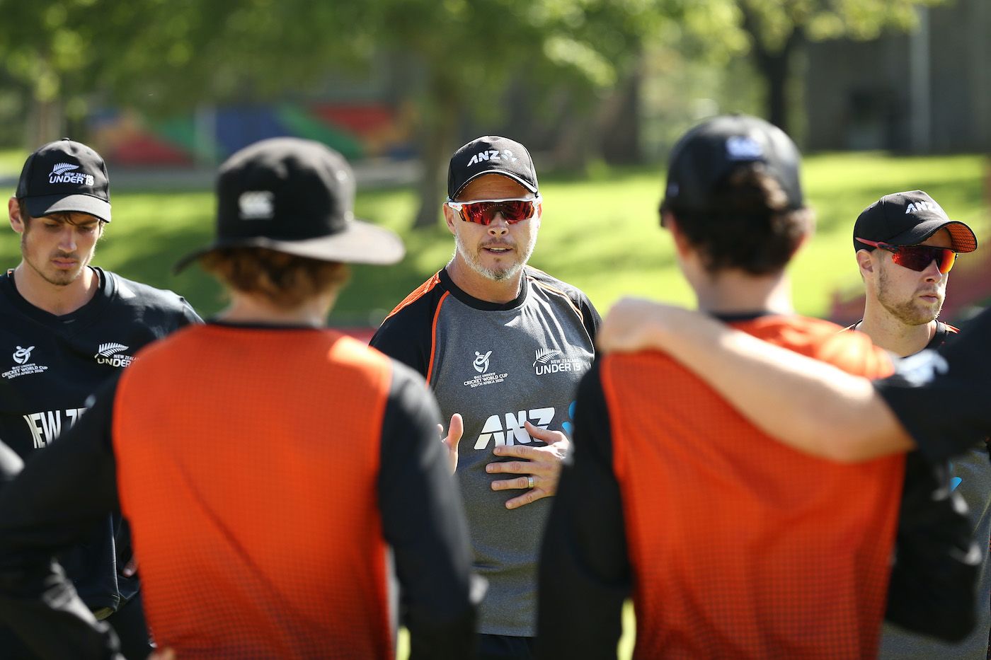 New Zealand Under 19 coach Paul Wiseman chats with players in the huddle